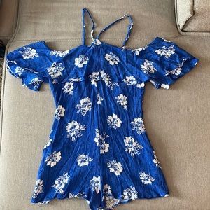 Lulus halter romper. Sleeves go off the shoulder. Open back key hole.